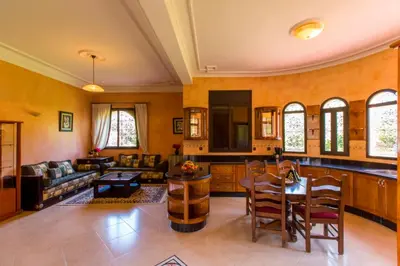 a living room with a couch and a table at Villa Zahra Palmeraie in Marrakech
