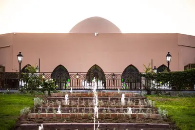 a building with a fountain in front of a building at Marrakech Ryads Parc All inclusive in Marrakech