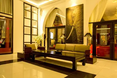 a living room with a couch and a coffee table at Adam Park Marrakech Hotel & Spa in Marrakech