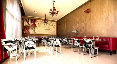 a restaurant with tables and chairs in a room at Adam Park Marrakech Hotel & Spa in Marrakech