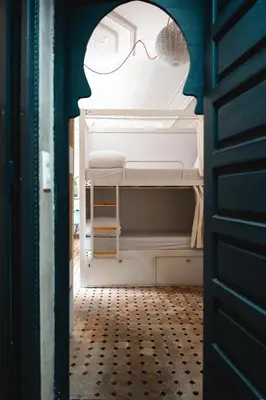 a room with an open refrigerator with glasses in it at The Central House Marrakech Medina in Marrakech