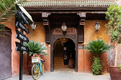 an entrance to a building with a bike parked outside at The Central House Marrakech Medina in Marrakech