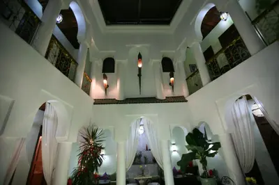 a room with white walls and a ceiling with windows at Riad Alida in Marrakech
