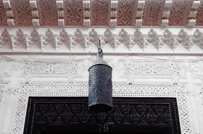 a light hanging from the ceiling of a building at La Terrasse Des Oliviers in Marrakech