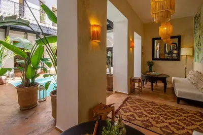 a living room with a couch and a table at Riad Bab 54 in Marrakech