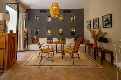 a living room with a dining table and chairs at Riad Bab 54 in Marrakech
