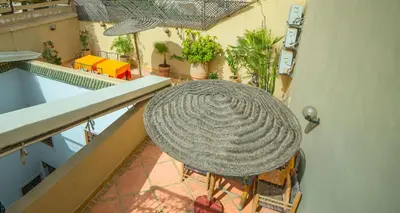 an overhead view of a balcony with a hat at Riad Euphorbe in Marrakech