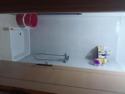 a kitchen counter with a sink and a faucet at Relaxation apartment in Marrakech