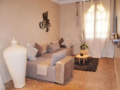 a living room with a couch and a table at Palais Lona in Marrakech
