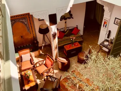 an overhead view of a living room with chairs and a couch at Dar Zemrane in Marrakech