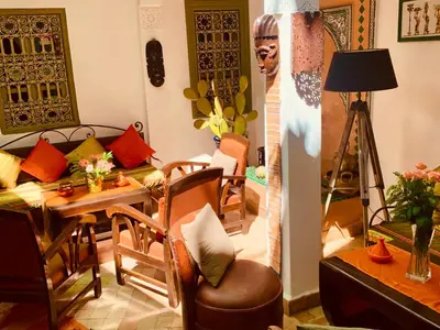 a living room with a couch and a table at Dar Zemrane in Marrakech