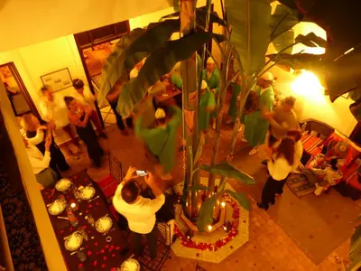 a group of people standing in a living room at Riad Marhbabikoum in Marrakech