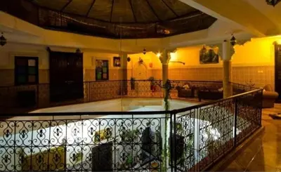 a lobby with a wrought iron fence in a building at Riad Chennaoui in Marrakech