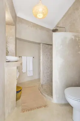 a bathroom with a toilet and a sink at Riad Helen in Marrakech