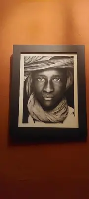 a picture of a bust of a woman on a wall at Riad Hayed in Marrakech