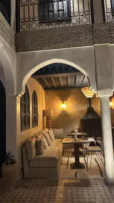a living room with a couch and a table at Riad Jonan & Spa in Marrakech
