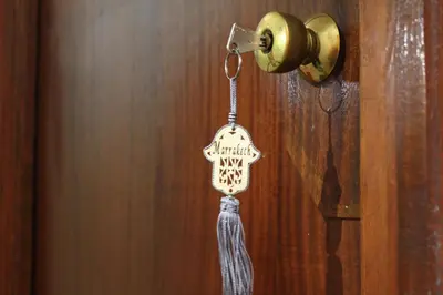 a tag is hanging from a door knob at El Hamra Hotel in Marrakech