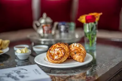 two pastries on a plate on a table at Riad Dar Tmania in Marrakech