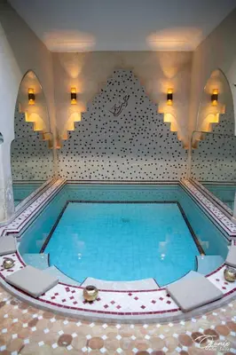 a large swimming pool in a room with at Riad Zoraida in Marrakech