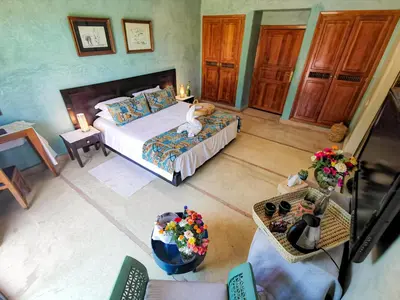 an aerial view of a bedroom with a bed at La Villa Des Golfs & PinkCactus in Marrakech