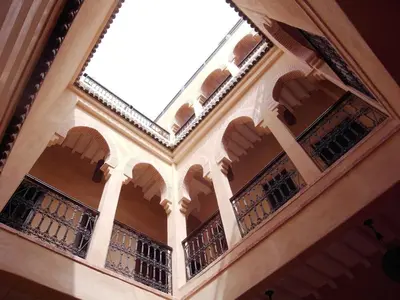 a building with balconies on the side of it at Riad Marrakiss in Marrakech