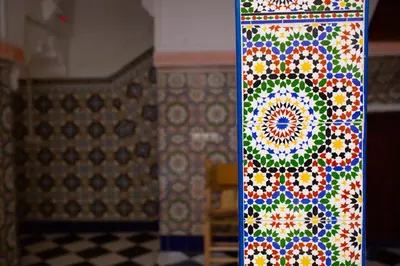 a colorful mandala pattern on a wall in a room at Mosaic Hostel in Marrakech