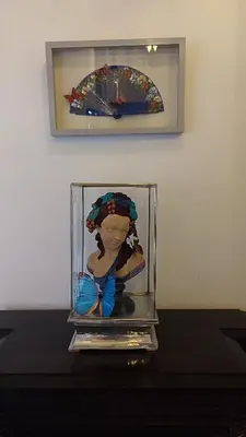 a statue of a woman in a glass box at Riad Dar Saad - Hammam & Spa in Marrakech