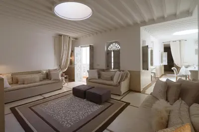 a large living room with couches and a table at Medina Dream Riad Exclusive Rental in Marrakech
