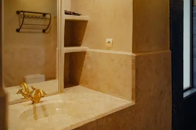 a bathroom with a shower with a sink at Outsite Marrakesh in Marrakech