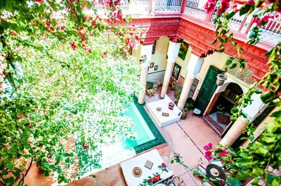 an overhead view of a house with a swimming pool at Riad Chorfa in Marrakech
