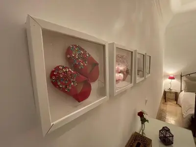 a room with two donuts on a wall at Riad Dar El Gnaouia in Marrakech