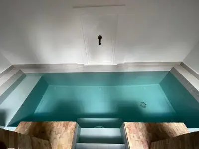 a pool of water in a room with at Riad Villa El Arsa in Marrakech