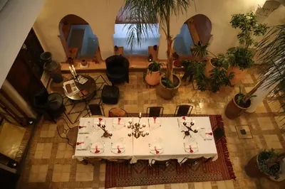 an overhead view of a table in a room with plants at Riad Villa El Arsa in Marrakech