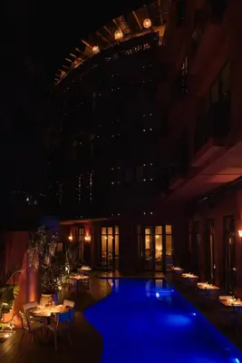 a pool in the middle of a building at night at Nobu Hotel Marrakech in Marrakech