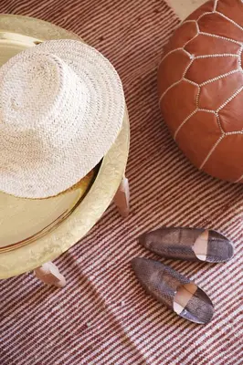 a straw hat and a ball and a pair ofippers at Riad l'Oiseau du Paradis in Marrakech