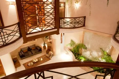 an overhead view of a living room with furniture and plants at Riad Alkaderi in Marrakech