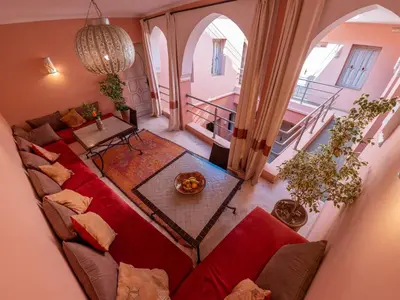 an overhead view of a living room with a red couch at Riad Tahani in Marrakech