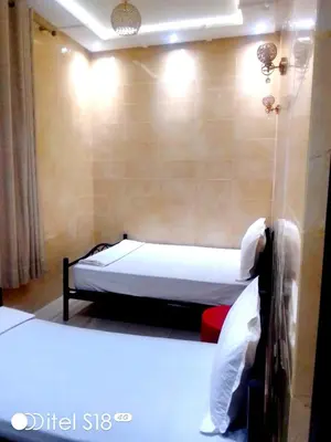 a small bedroom with a bed in a room at Résidence Miramare Marrakech in Marrakech