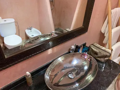 a bathroom with a sink and a mirror at Riad 58 Blu in Marrakech