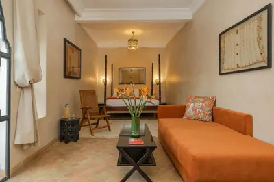 a living room with a couch and a table at Riad D'ari in Marrakech