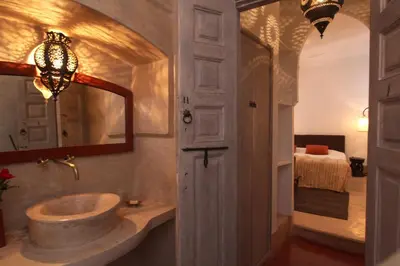 a bathroom with a sink and a mirror at Riad O2 in Marrakech