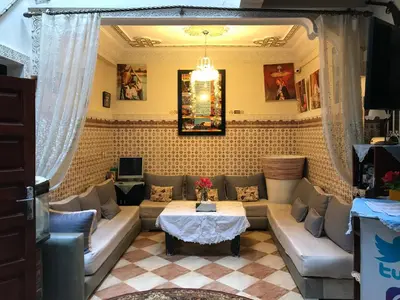 a living room with a couch and a table at Hostel Dream belko in Marrakech