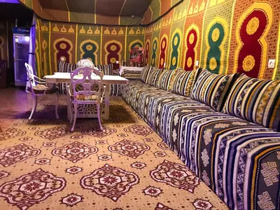 a room with a table and chairs and a table and chairs at Hostel Dream belko in Marrakech