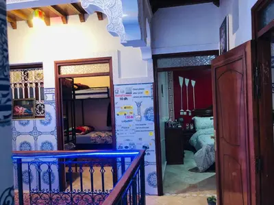 a room with a hallway with a mirror and a bedroom at Hostel Dream belko in Marrakech