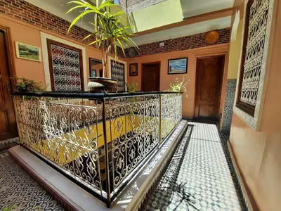 a balcony with a wrought iron railing in a house at Riad 112 in Marrakech