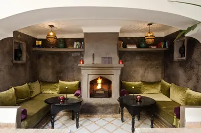 a living room with a couch and a fireplace at Dar Rocmarra in Marrakech