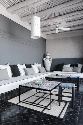 a living room with a couch and a table at Riad Dar Bahi in Marrakech