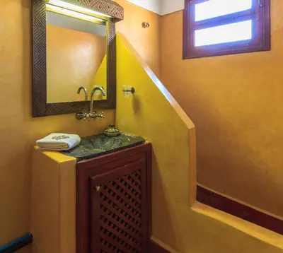 a bathroom with a sink and a mirror at Riad Zen House in Marrakech