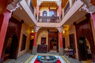 a large room with a table in the middle of a building at Samira Group & Spa in Marrakech