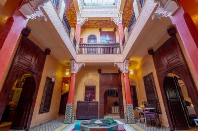 a large room with a building with a balcony at Samira Group & Spa in Marrakech